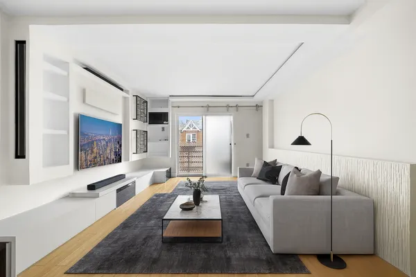 a living room with furniture rug and window