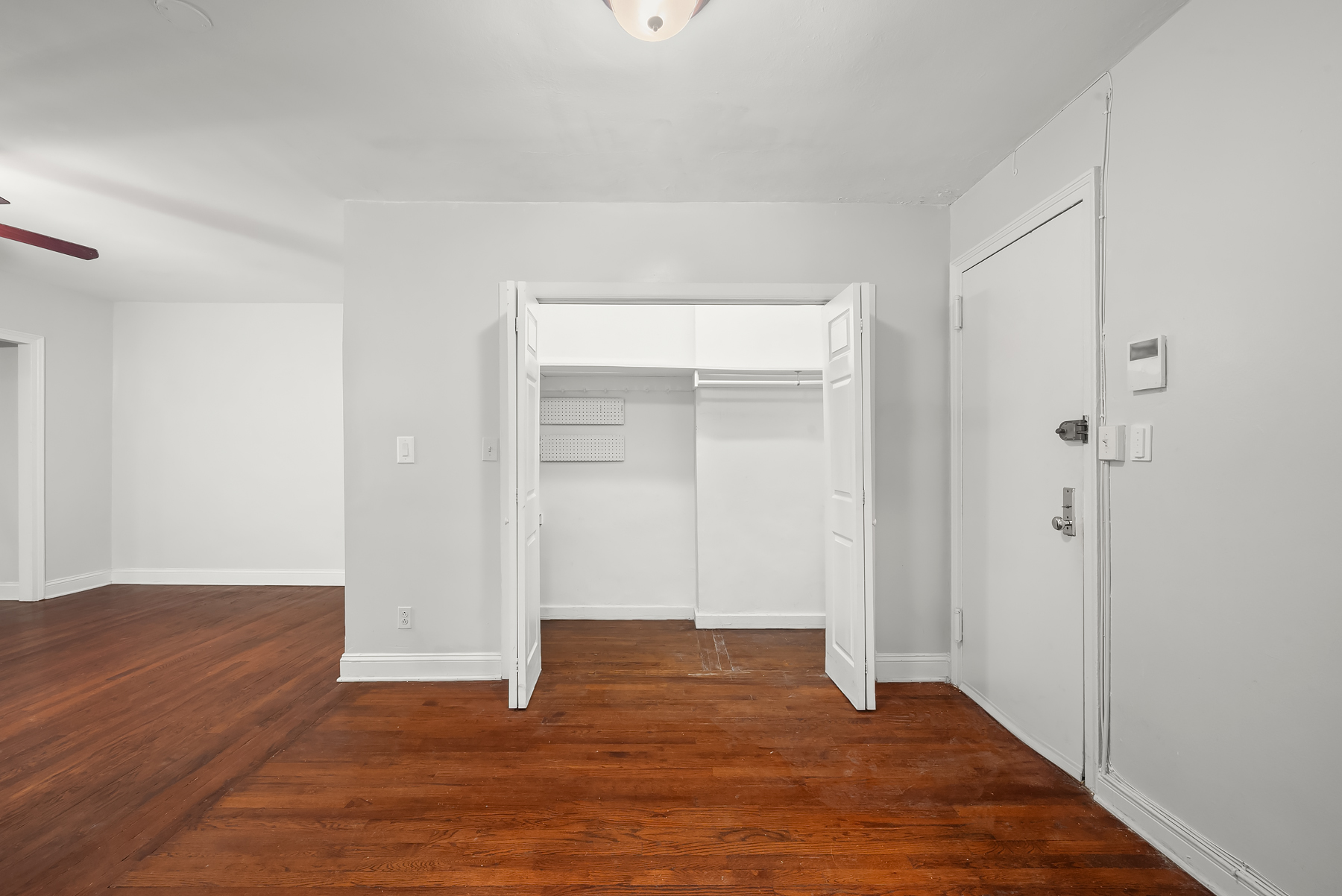 30-31 Hobart Street, Unit 3L Queens, NY 11377 - Photo 9 of 14 a view of an empty room with wooden floor