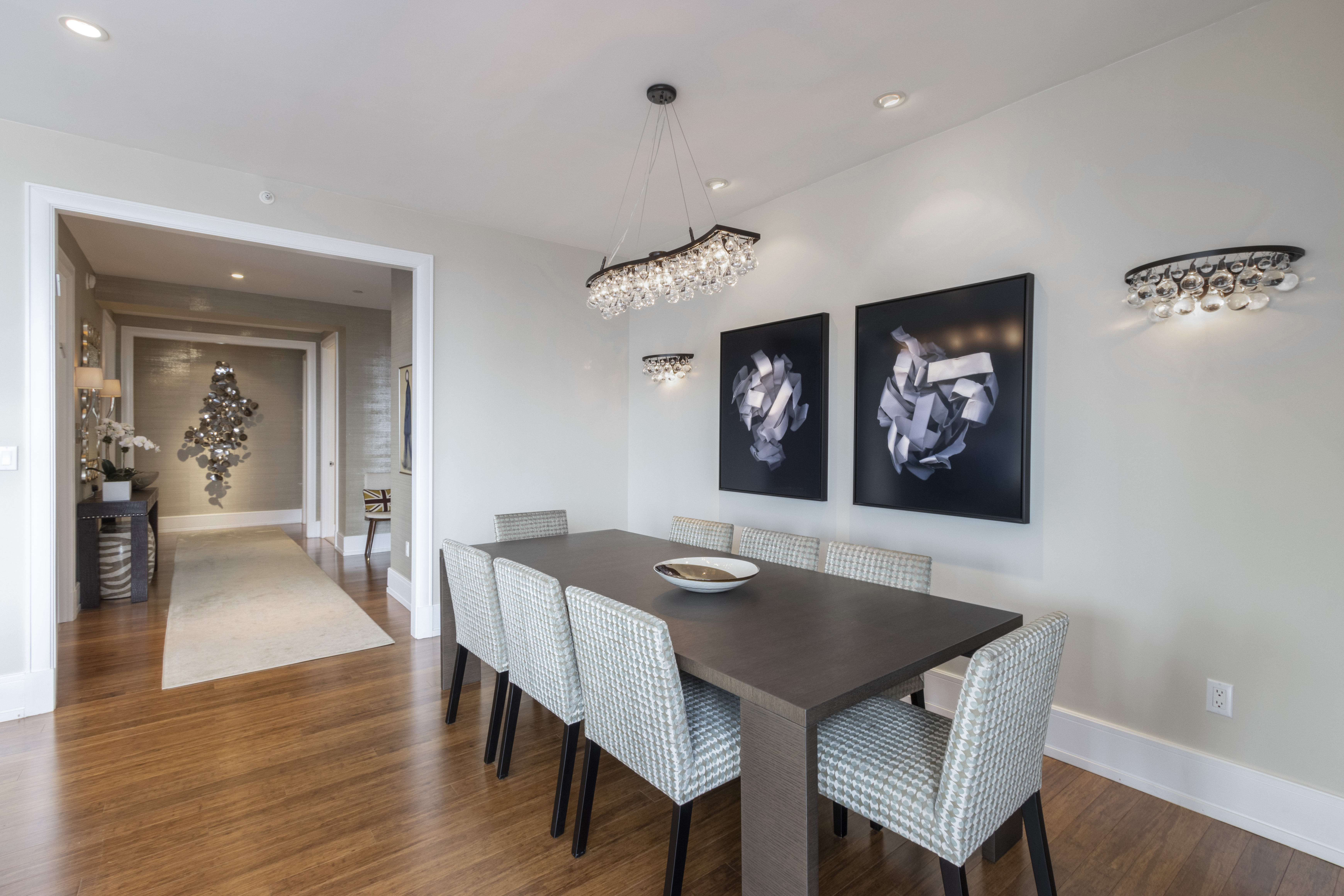 255 East 74th Street, Unit 25B Manhattan, NY 10021 - Photo 8 of 23 a view of a dining room with furniture and wooden floor
