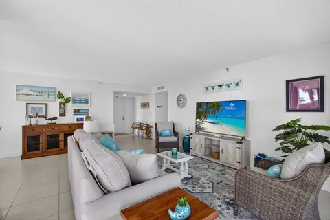 a bedroom with furniture and large window