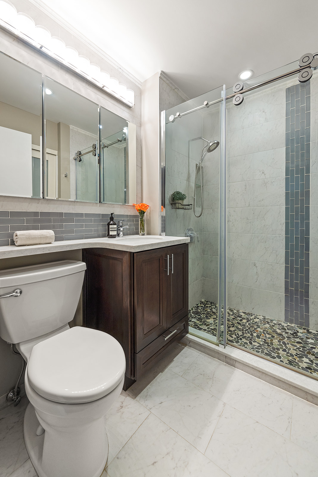 133 Water Street, Unit 8E Brooklyn, NY 11201 - Photo 11 of 16 a bathroom with a sink a toilet and shower