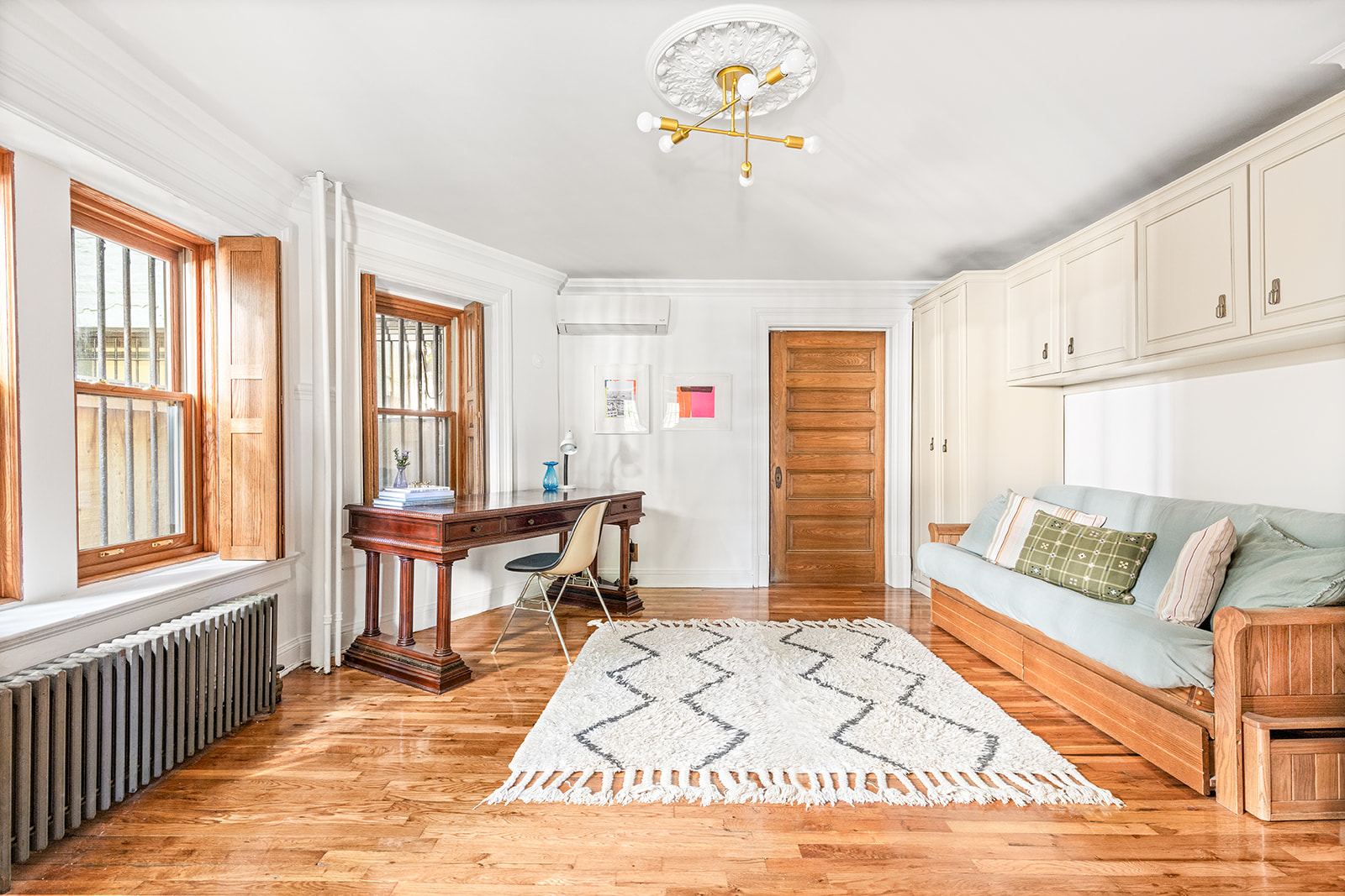 102 Prospect Park West, Unit 2 Brooklyn, NY 11215 - Photo 6 of 12 a living room with patio furniture and a wooden floor