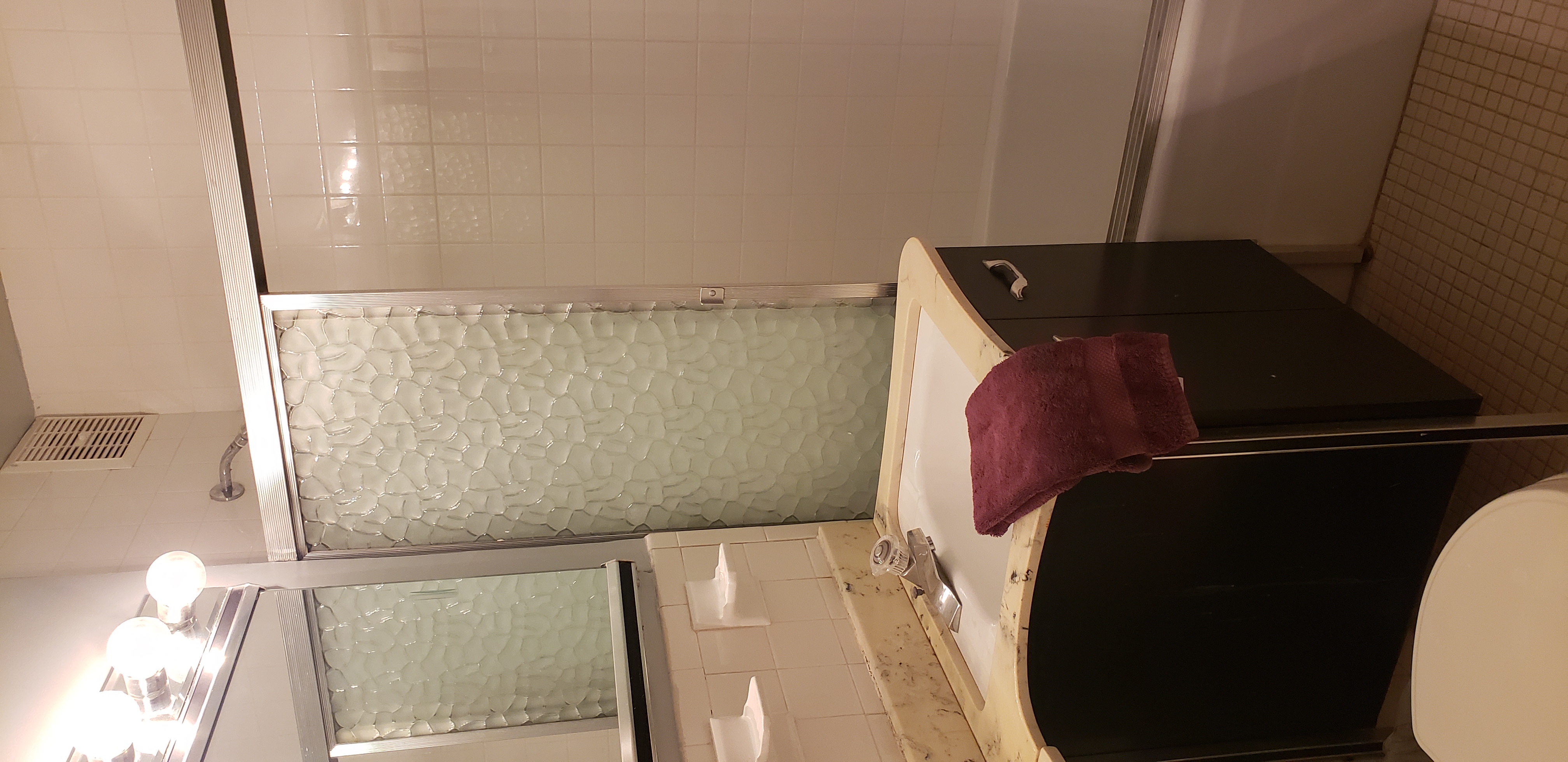 70-25 Yellowstone Boulevard, Unit 2M Queens, NY 11375 - Photo 9 of 23 a bathroom with a granite countertop sink and a mirror