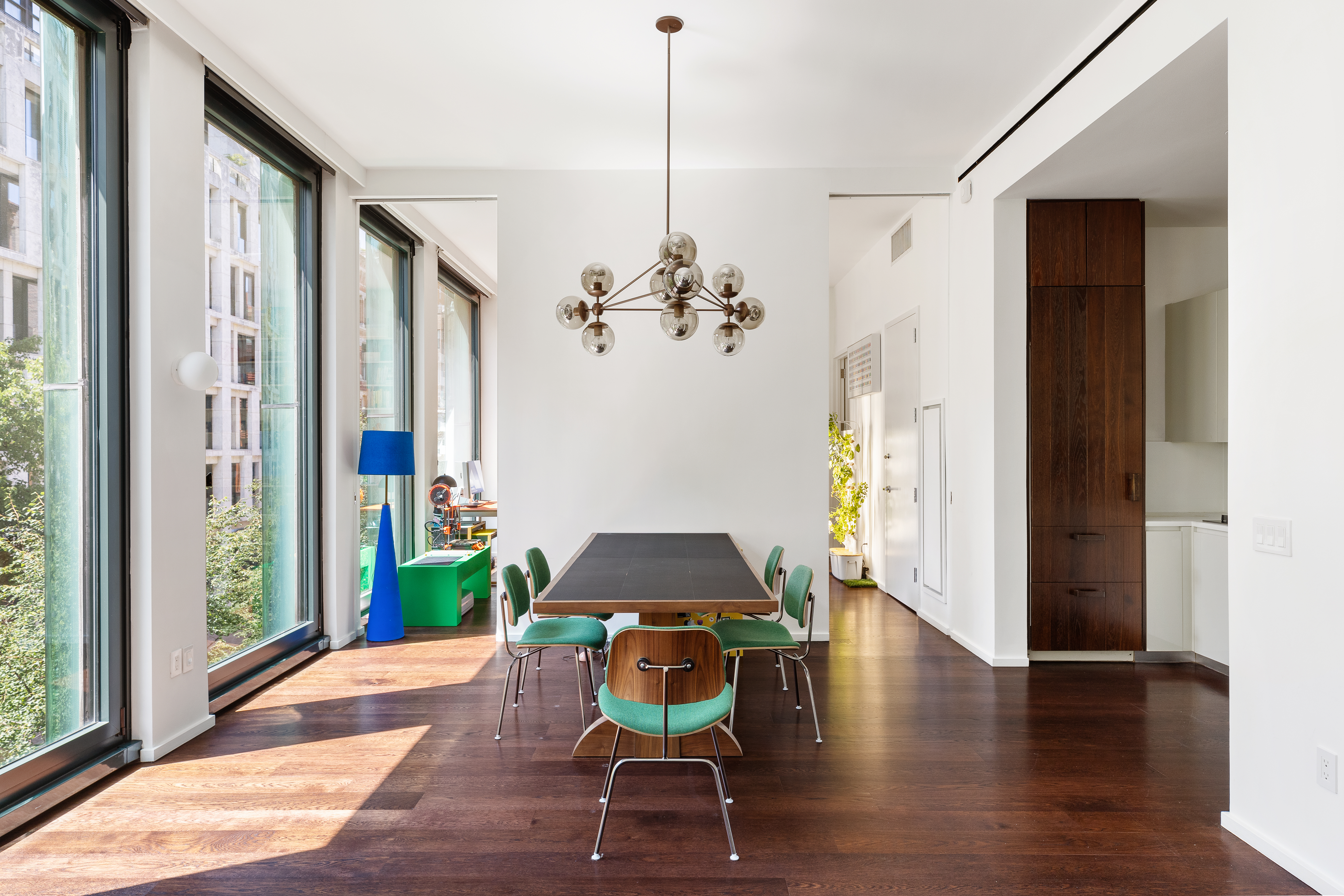 40 Bond Street, Unit 4B Manhattan, NY 10012 - Photo 2 of 9 a living room with furniture and a chandelier