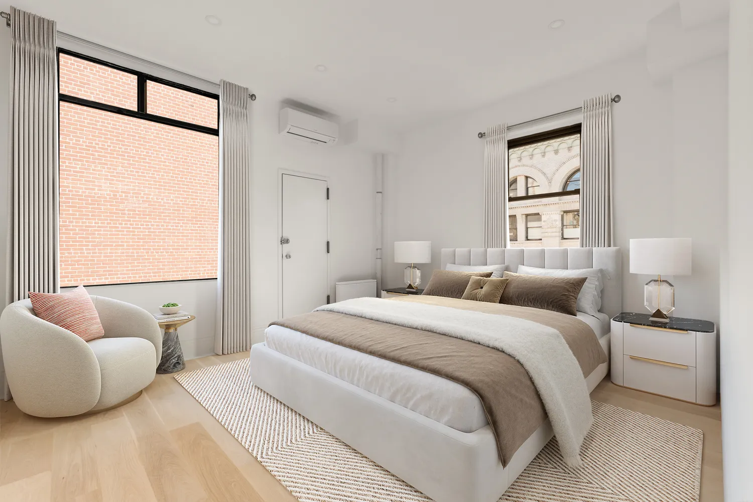 a bedroom with a bed and a couch next to a window