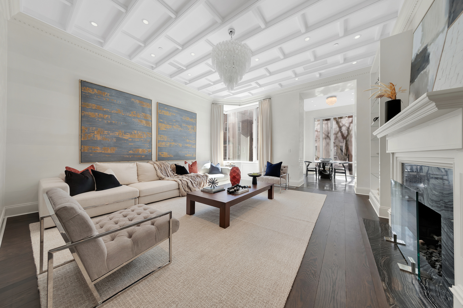 a living room with furniture a fireplace and a table