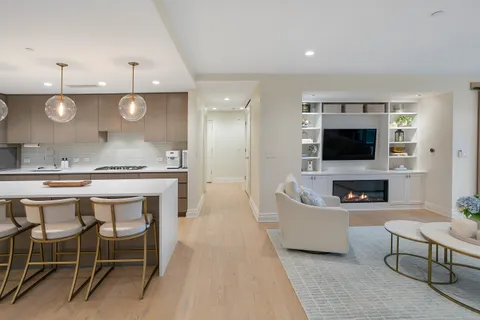 a kitchen with a table and chairs in it
