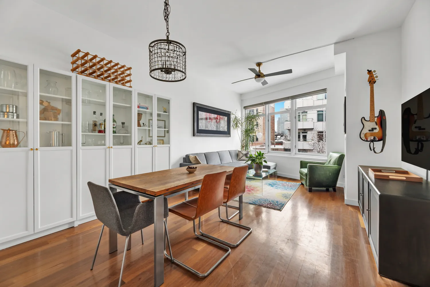 a view of a dining room with furniture wooden floor and a chandelier
