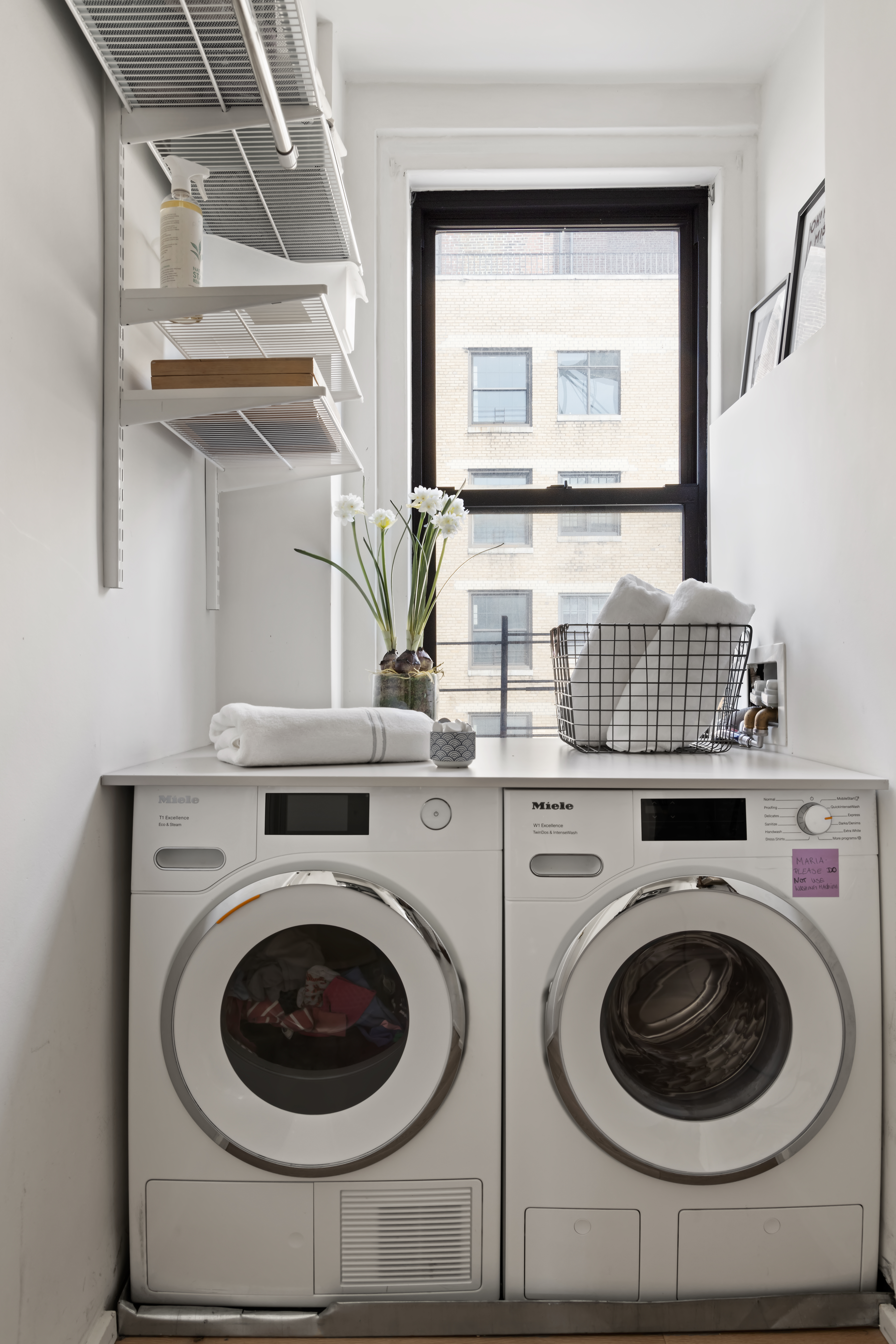 45 5th Avenue, Unit 15CD Manhattan, NY 10003 - Photo 13 of 14 a utility room with sink dryer and washer