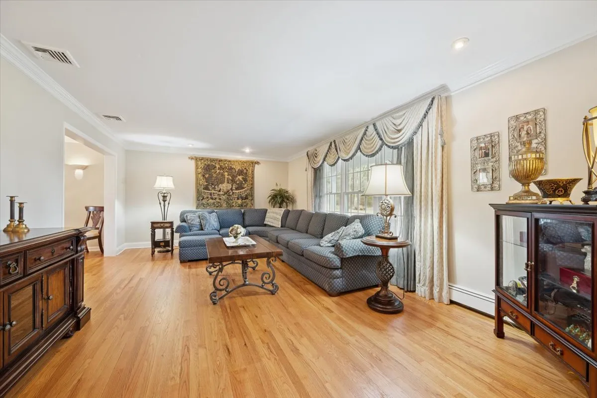 a living room with furniture and a table