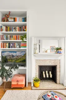 a living room with furniture and a fireplace