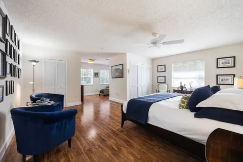a bedroom with a bed and a couch
