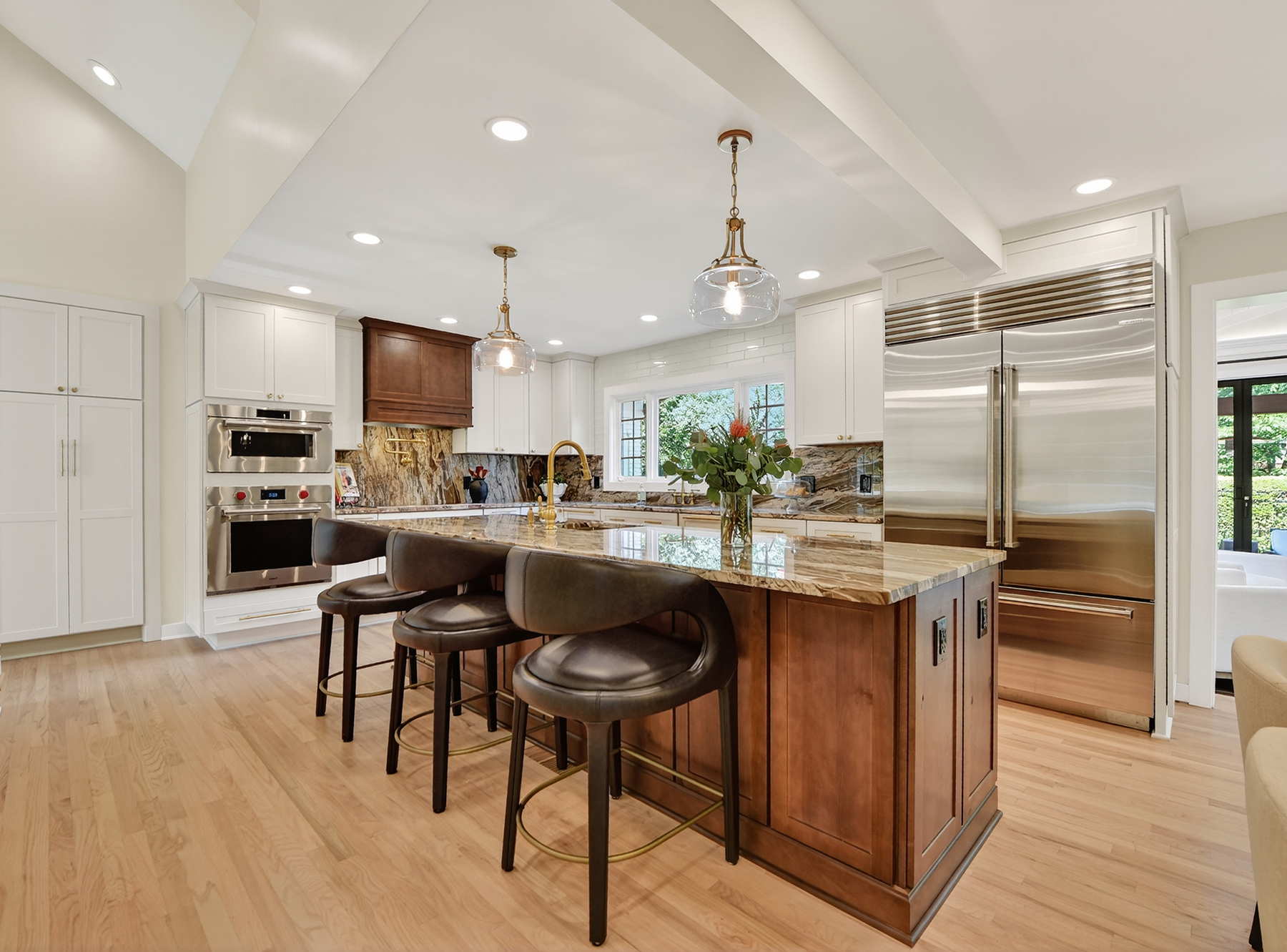 1205 Beaver Road Sewickley, PA 15143 - Photo 10 of 94 a kitchen with stainless steel appliances kitchen island granite countertop a table chairs and a refrigerator