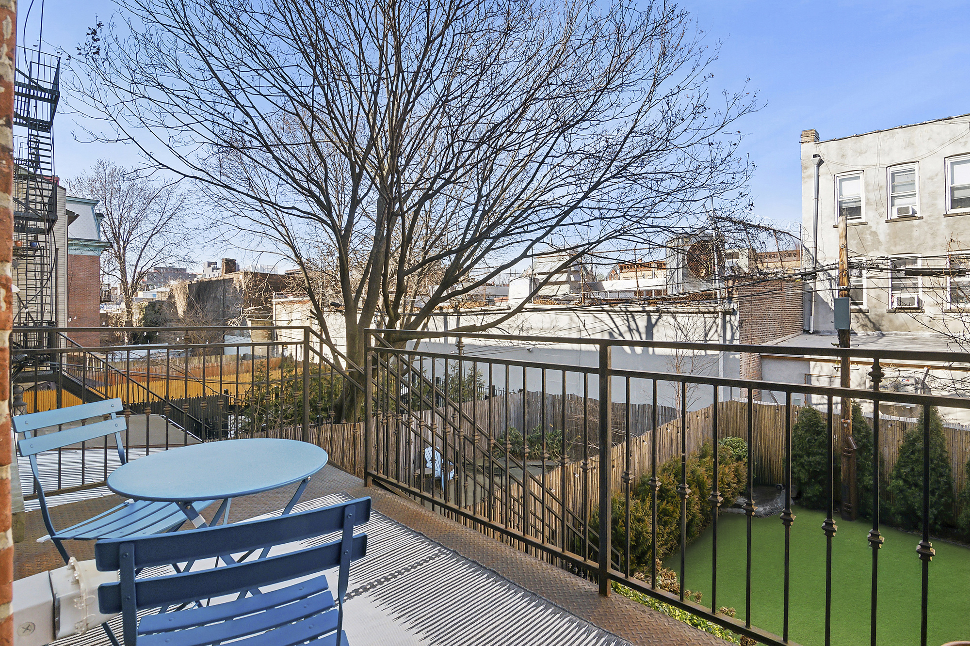147 Herkimer Street Brooklyn, NY 11216 - Photo 7 of 25 a view of a balcony with wooden floor and fence