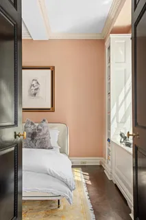 a spacious bedroom with a bed and a large window