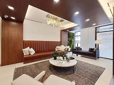 2351 Adam Clayton Powell Jr Boulevard, Unit 306 Manhattan, NY 10030 - Photo 7 of 13 a living room with furniture and a rug