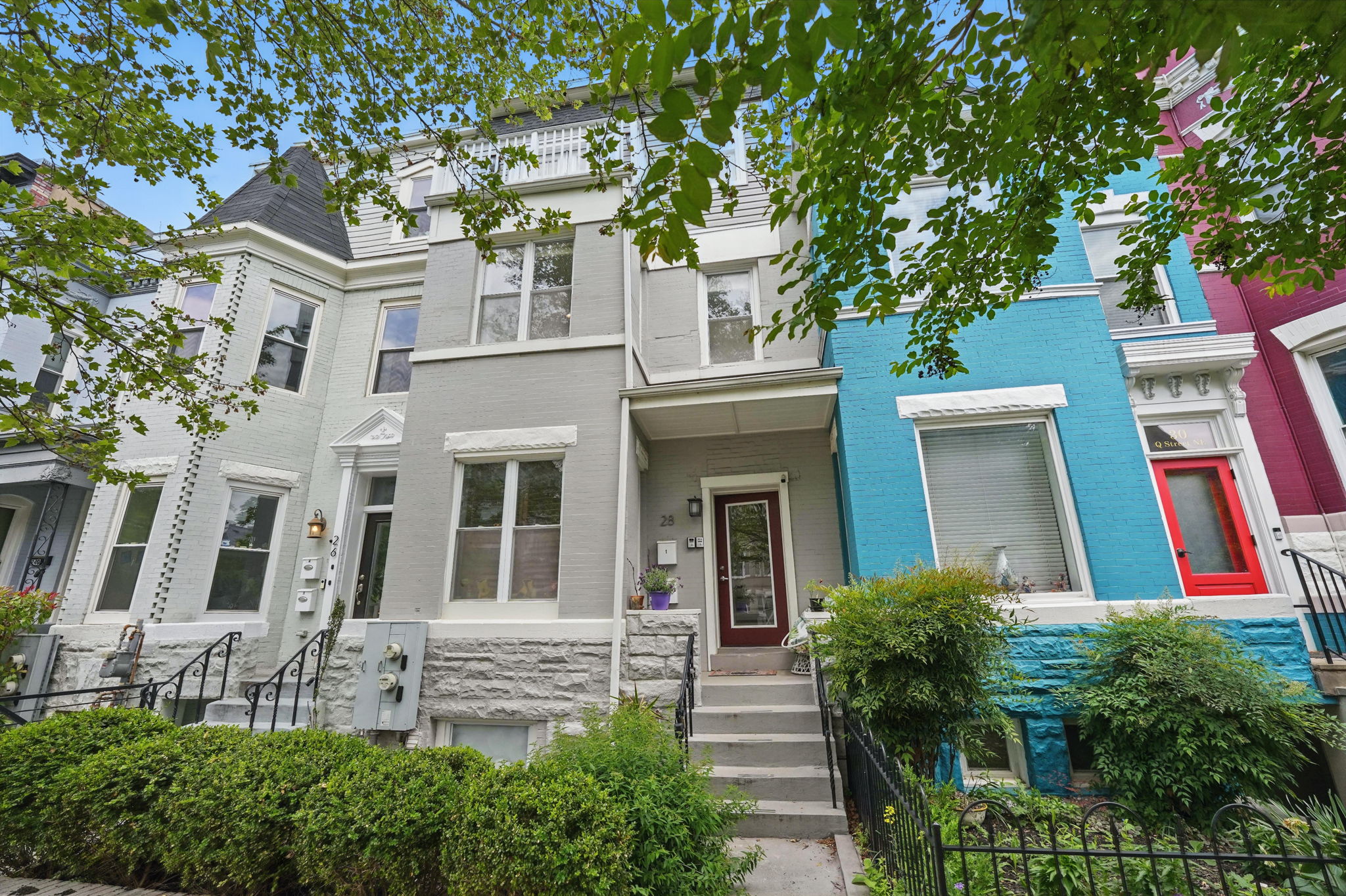 28 Q Street Northeast, Unit 2 Washington, DC 20002 - Photo 5 of 41 a view of a brick building next to a large tree