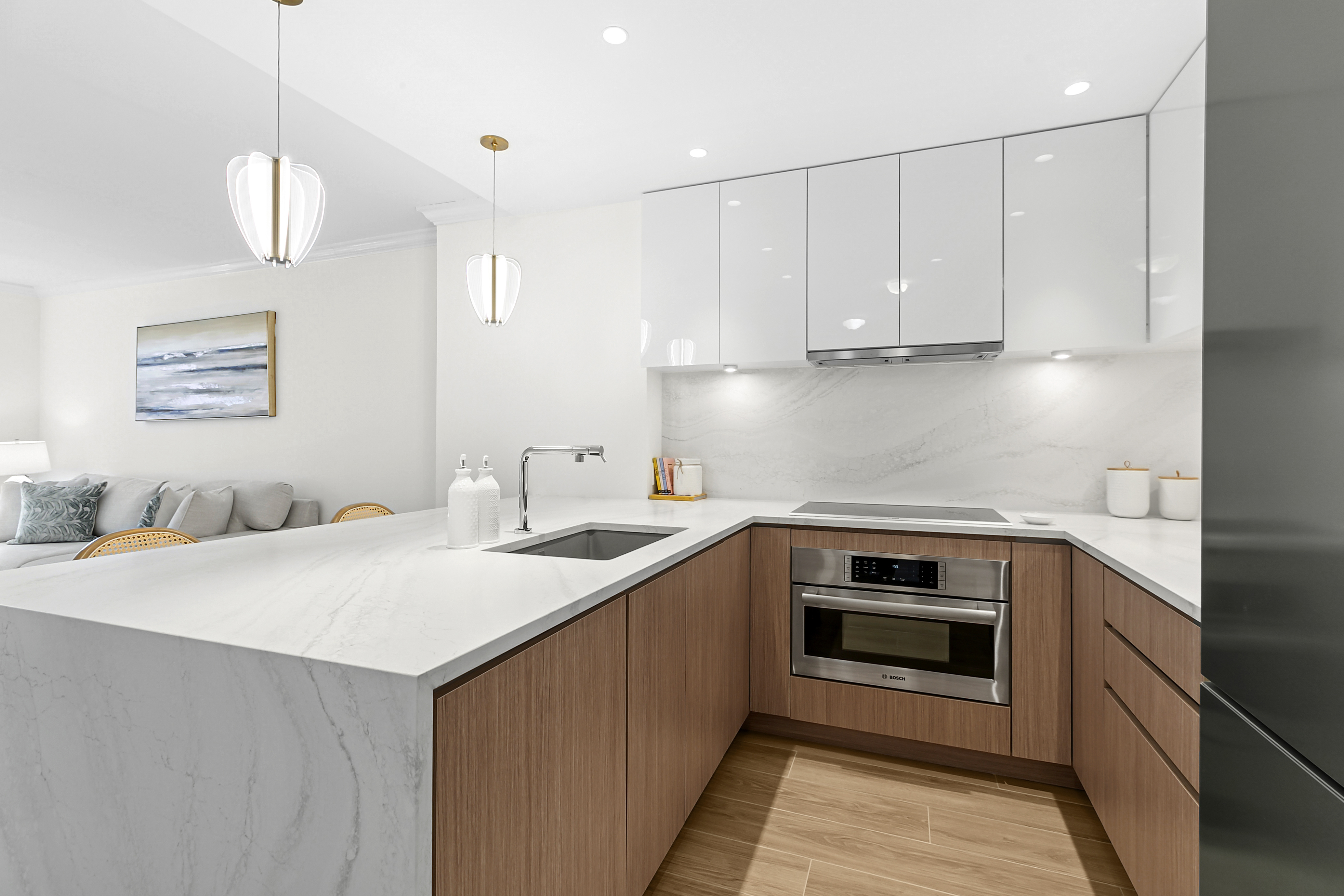350 East 82nd Street, Unit 4C Manhattan, NY 10028 - Photo 3 of 13 a kitchen with a sink stove and white cabinets