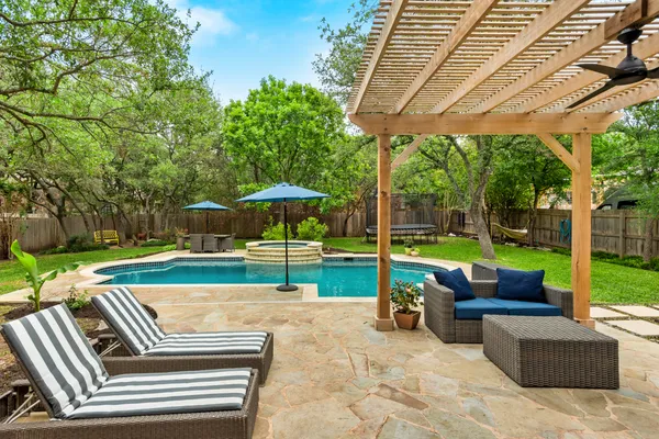 a view of pool with outdoor seating