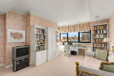 a spacious bathroom with a sink a large mirror and a bathtub