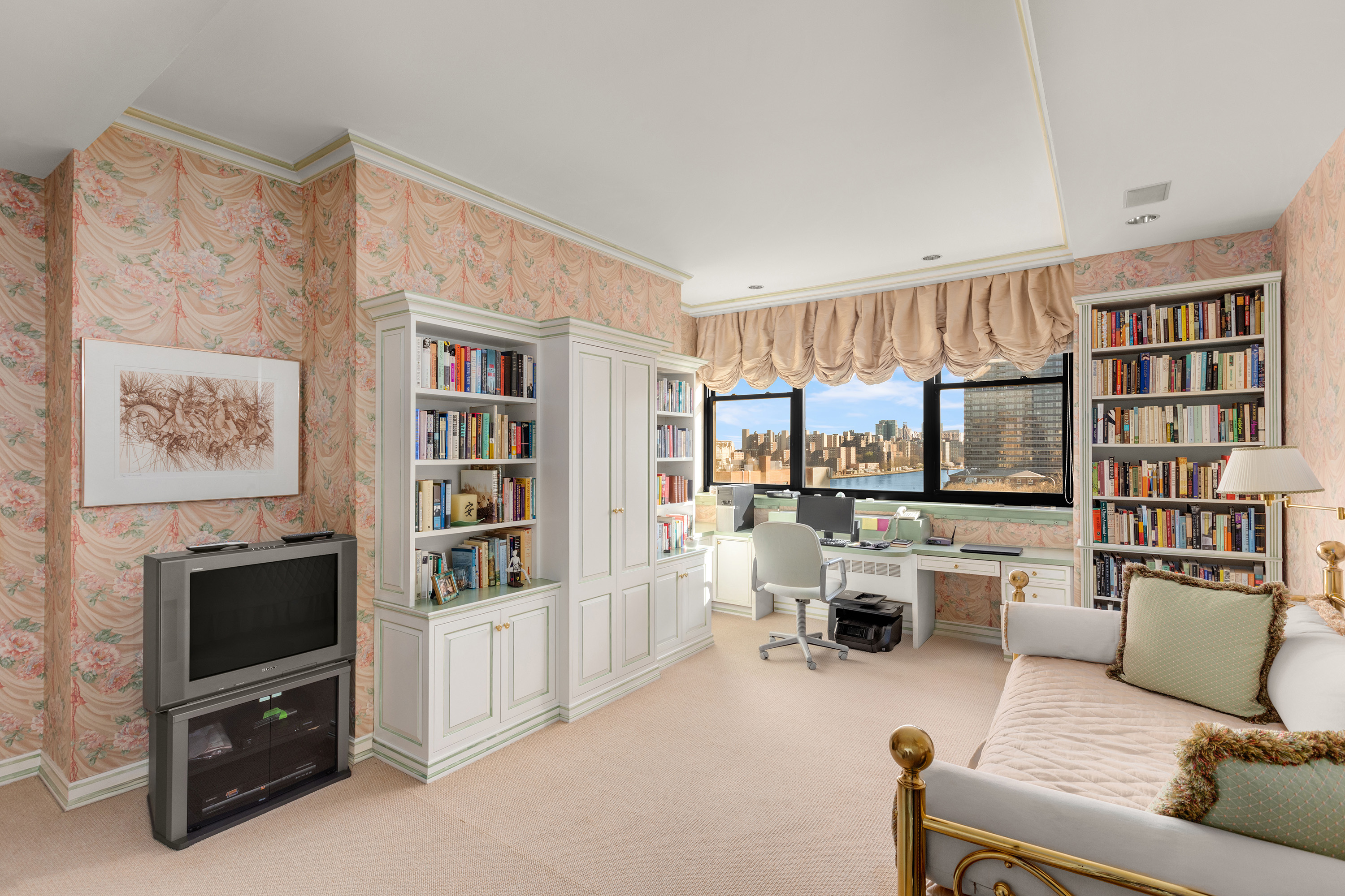 2 East End Avenue, Unit PHG Manhattan, NY 10075 - Photo 10 of 15 a living room with furniture and a flat screen tv