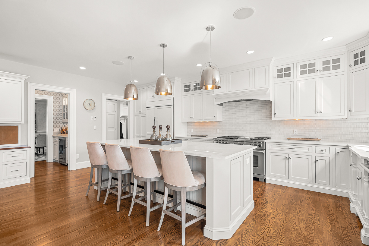 Country Way Needham, MA 02492 - Photo 9 of 27 a kitchen with stainless steel appliances a table chairs refrigerator and sink