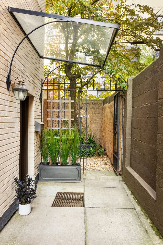 315 Washington Avenue Brooklyn, NY 11205 - Photo 30 of 38 a view of a pathway along a building and potted plants