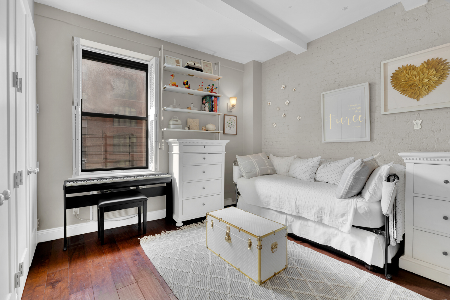 23 East 10th Street, Unit 321 Manhattan, NY 10003 - Photo 5 of 10 a bedroom with a bed and a window