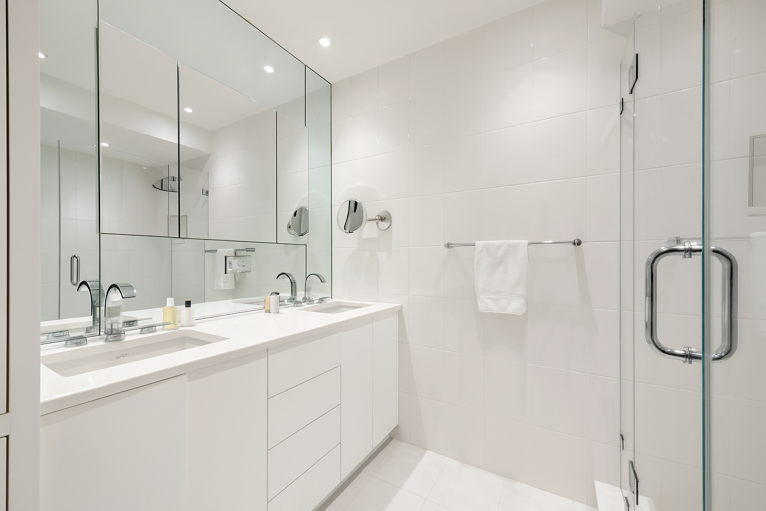 150 East 69th Street, Unit 7K Manhattan, NY 10021 - Photo 21 of 22 a bathroom with a sink mirror and shower