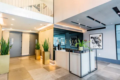 a view of a hallway with dining area