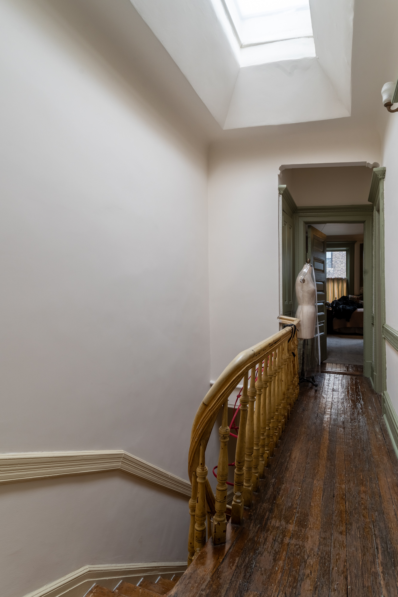 426 West 160th Street Manhattan, NY 10032 - Photo 17 of 33 a view of a hallway with wooden floor and staircase