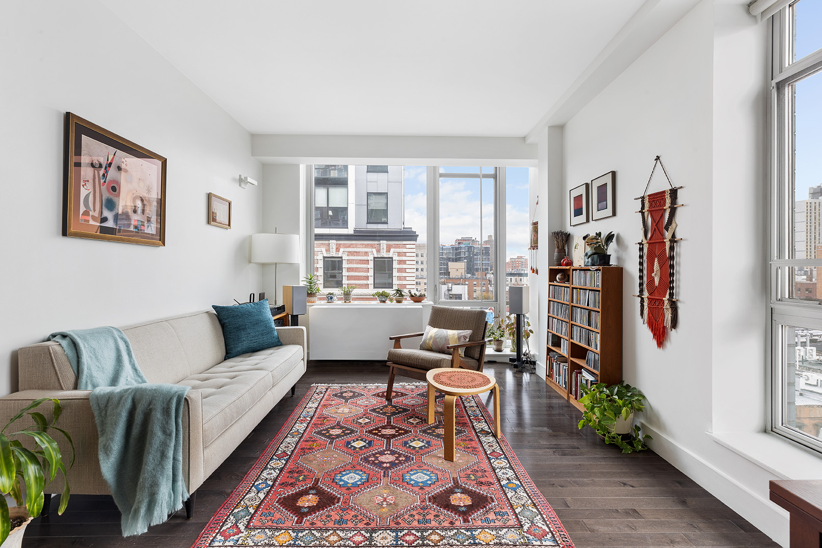 a living room with furniture and a rug