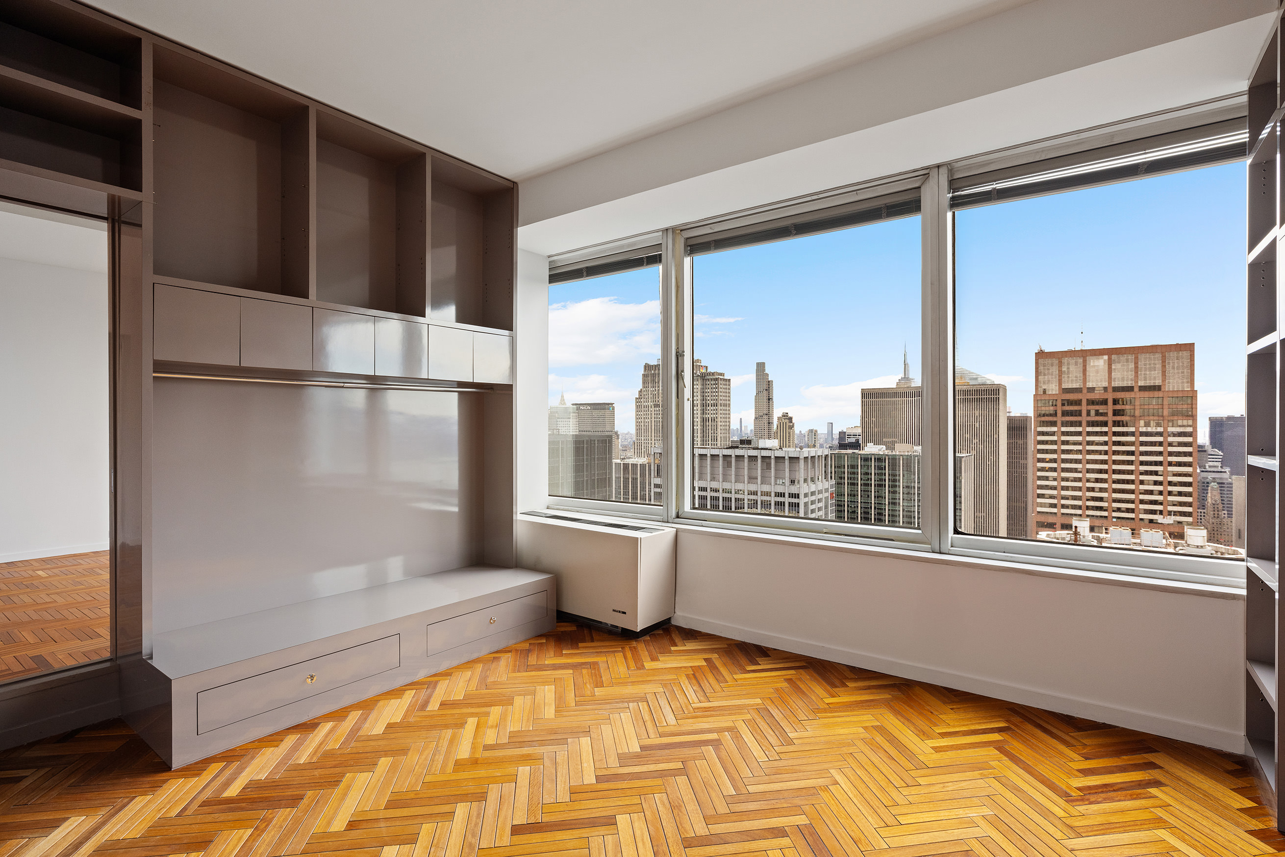 150 West 56th Street, Unit 6204 Manhattan, NY 10019 - Photo 12 of 15 a view of a living room with a large window