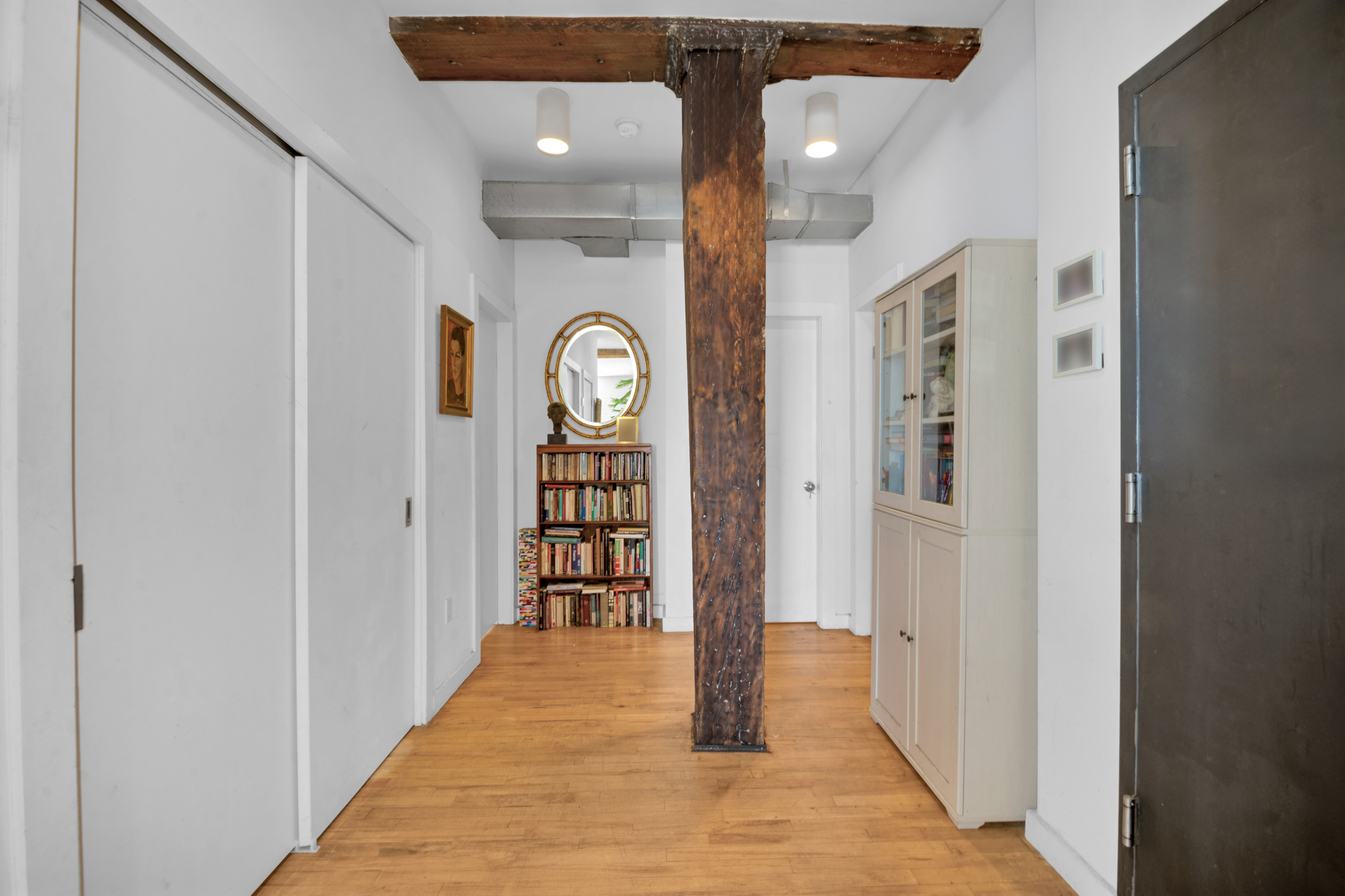 25 Carroll Street, Unit 4C Brooklyn, NY 11231 - Photo 19 of 27 a view of a hallway with wooden floor and staircase
