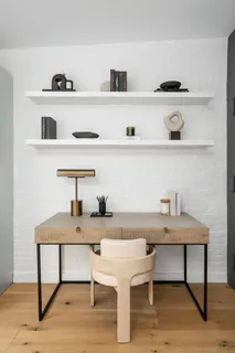 a view of a workspace with furniture