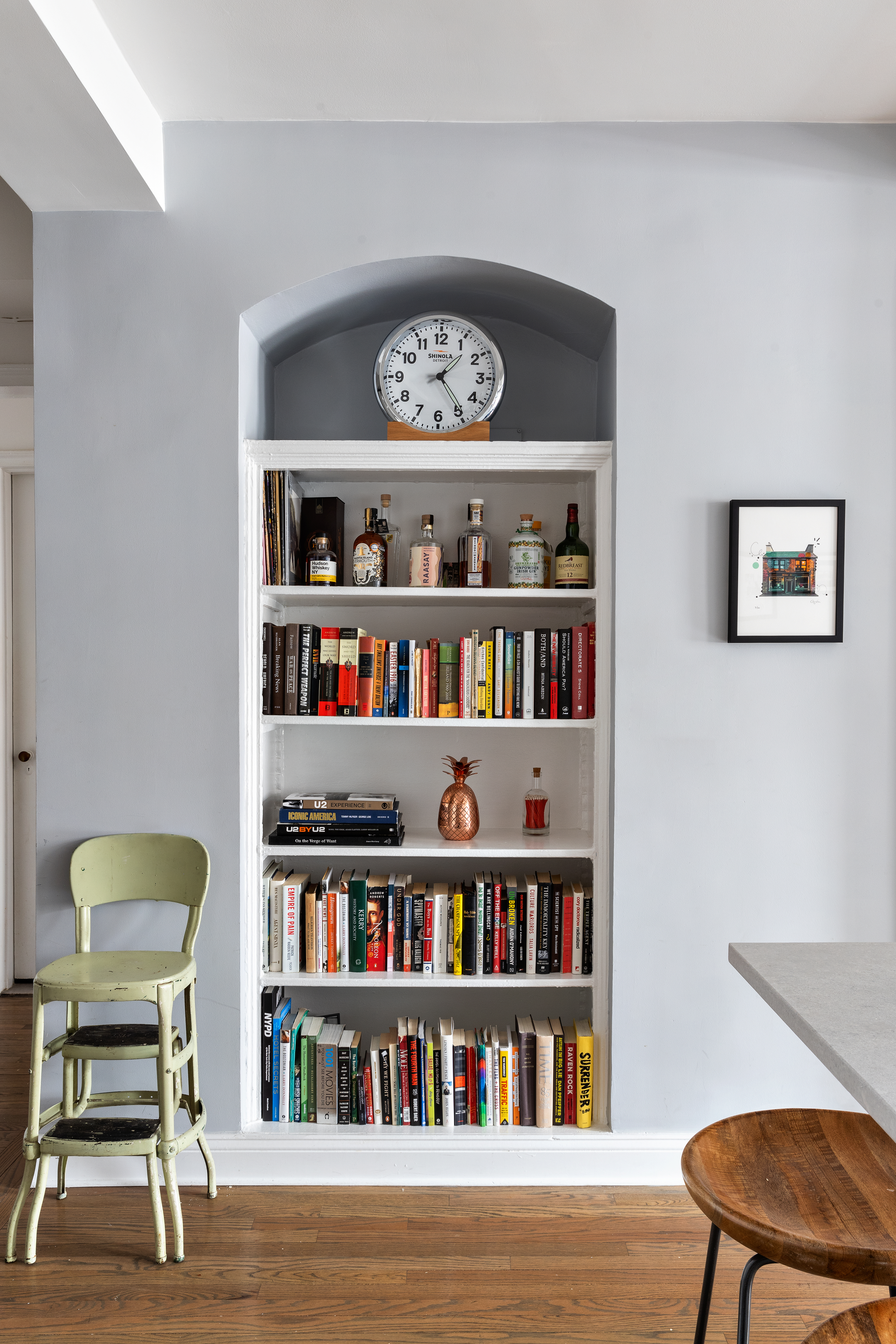 410 West 24th Street, Unit 9K Manhattan, NY 10011 - Photo 7 of 10 a view of a workspace with furniture and a bookshelf