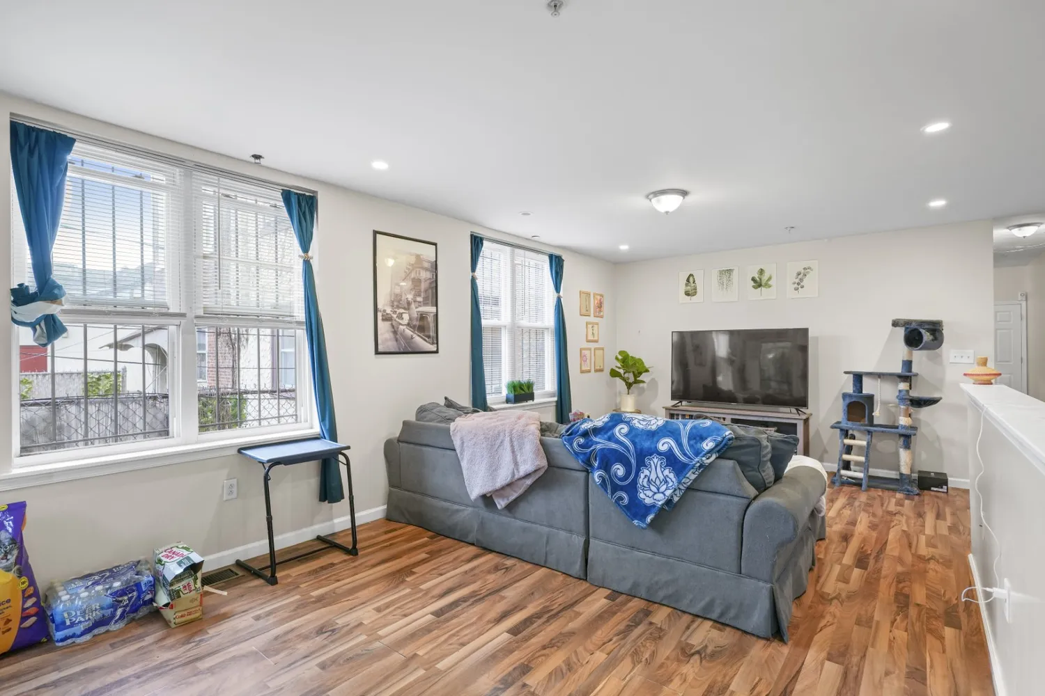a bathroom with a sink a toilet and shower curtain