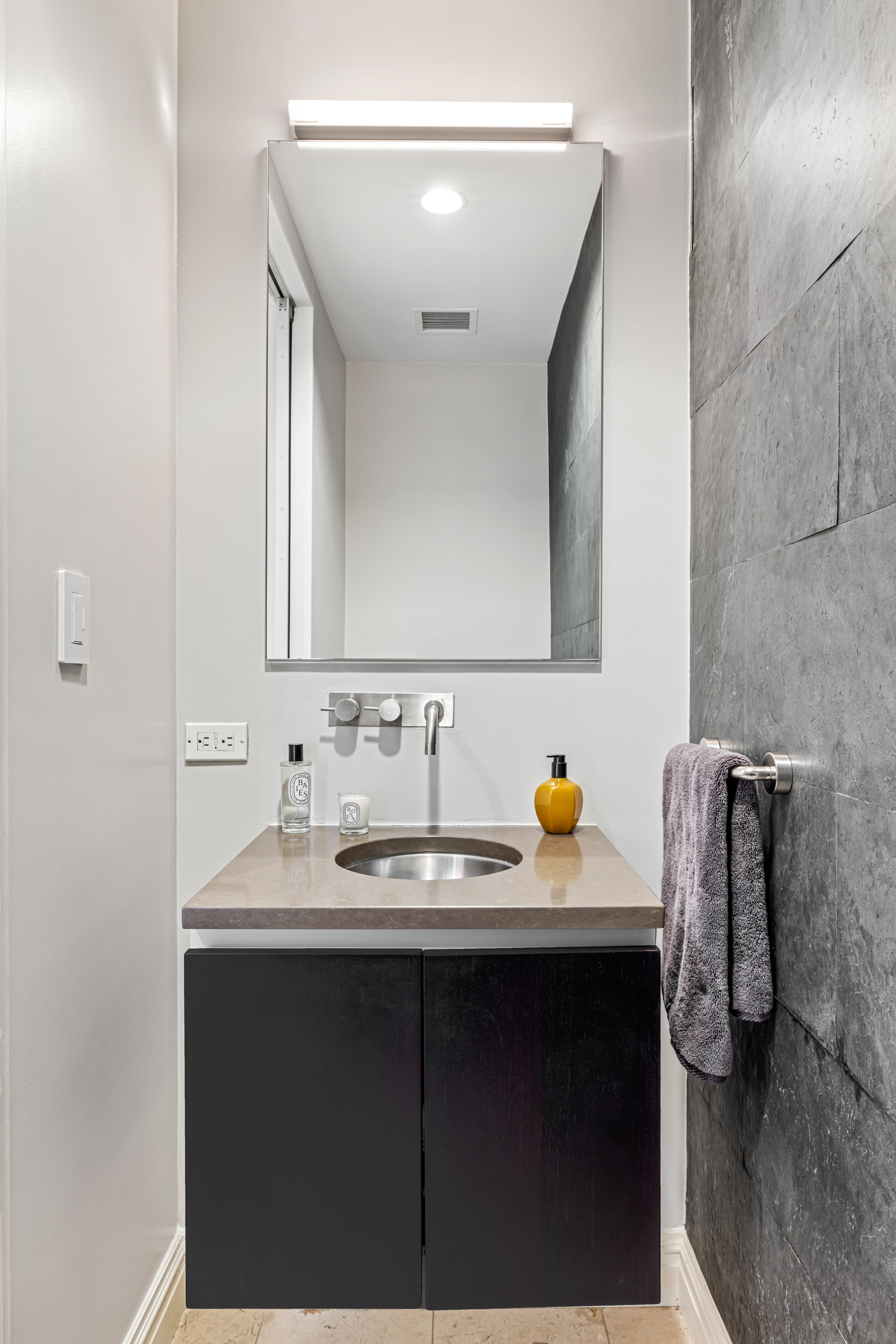51 Walker Street, Unit 6B Manhattan, NY 10013 - Photo 6 of 10 a bathroom with a sink and a mirror