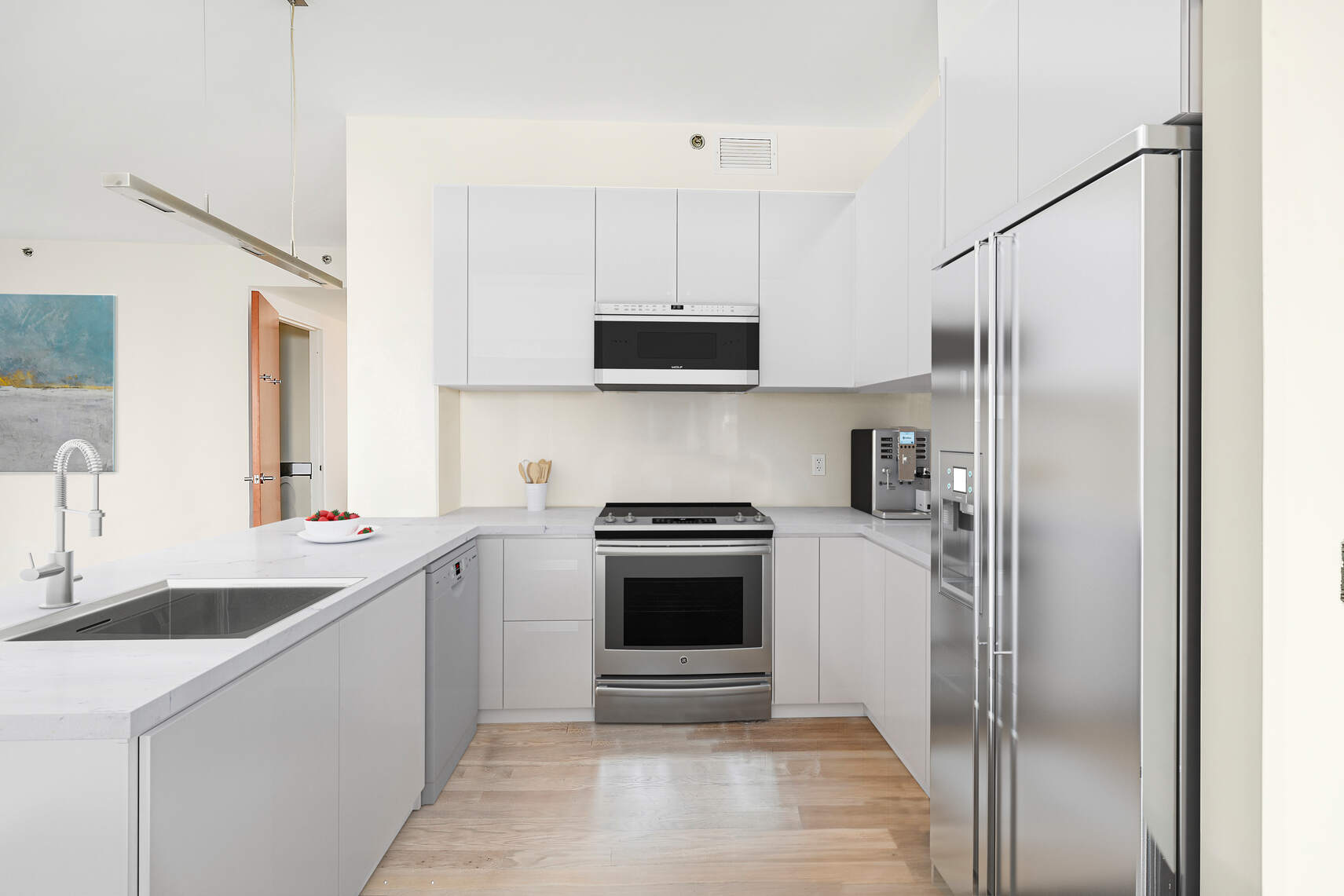 454 West 54th Street, Unit 3A Manhattan, NY 10019 - Photo 3 of 13 a kitchen with a sink cabinets and stainless steel appliances