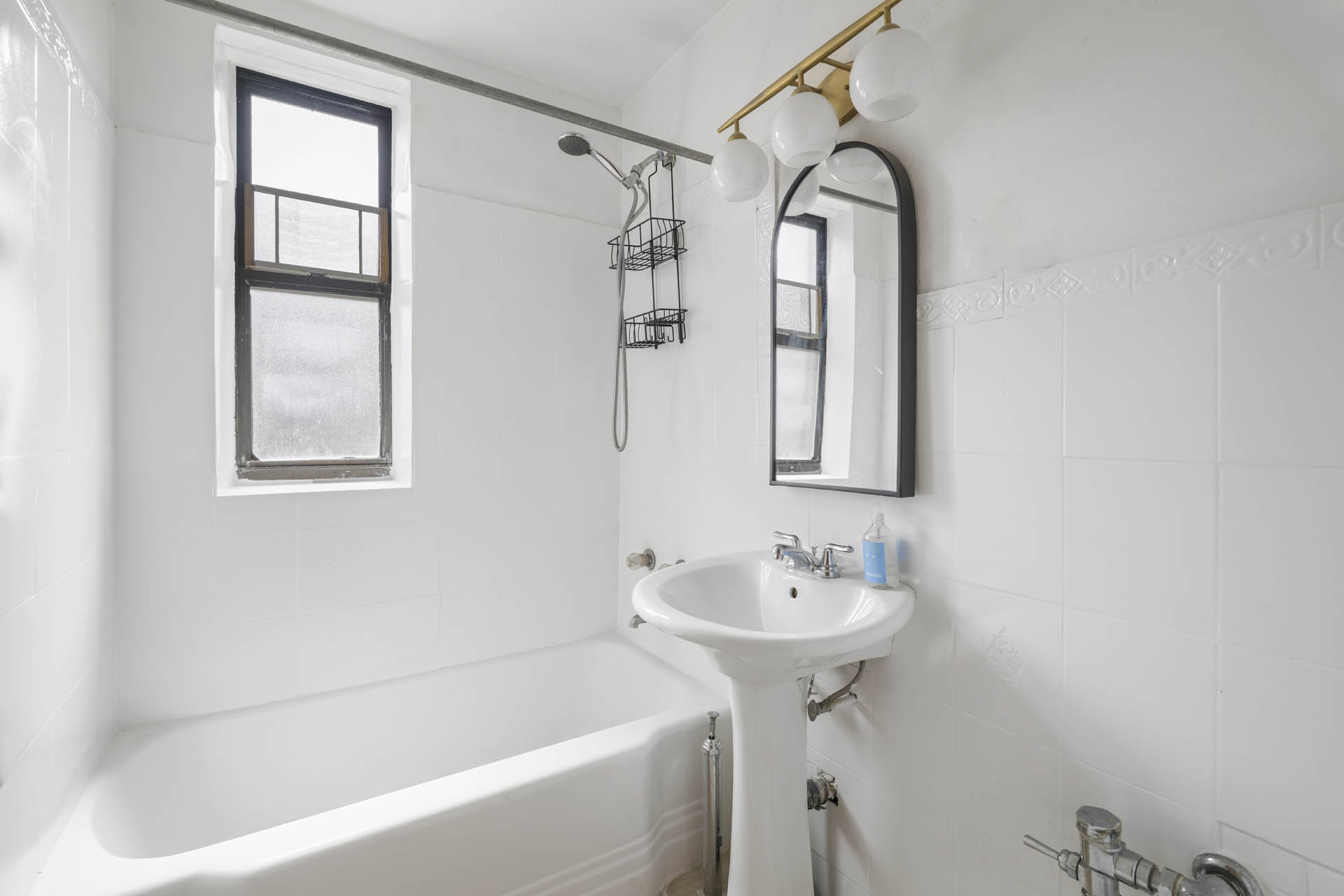 2420 Morris Avenue, Unit 6K Bronx, NY 10468 - Photo 6 of 7 a bathroom with a sink bathtub and a window