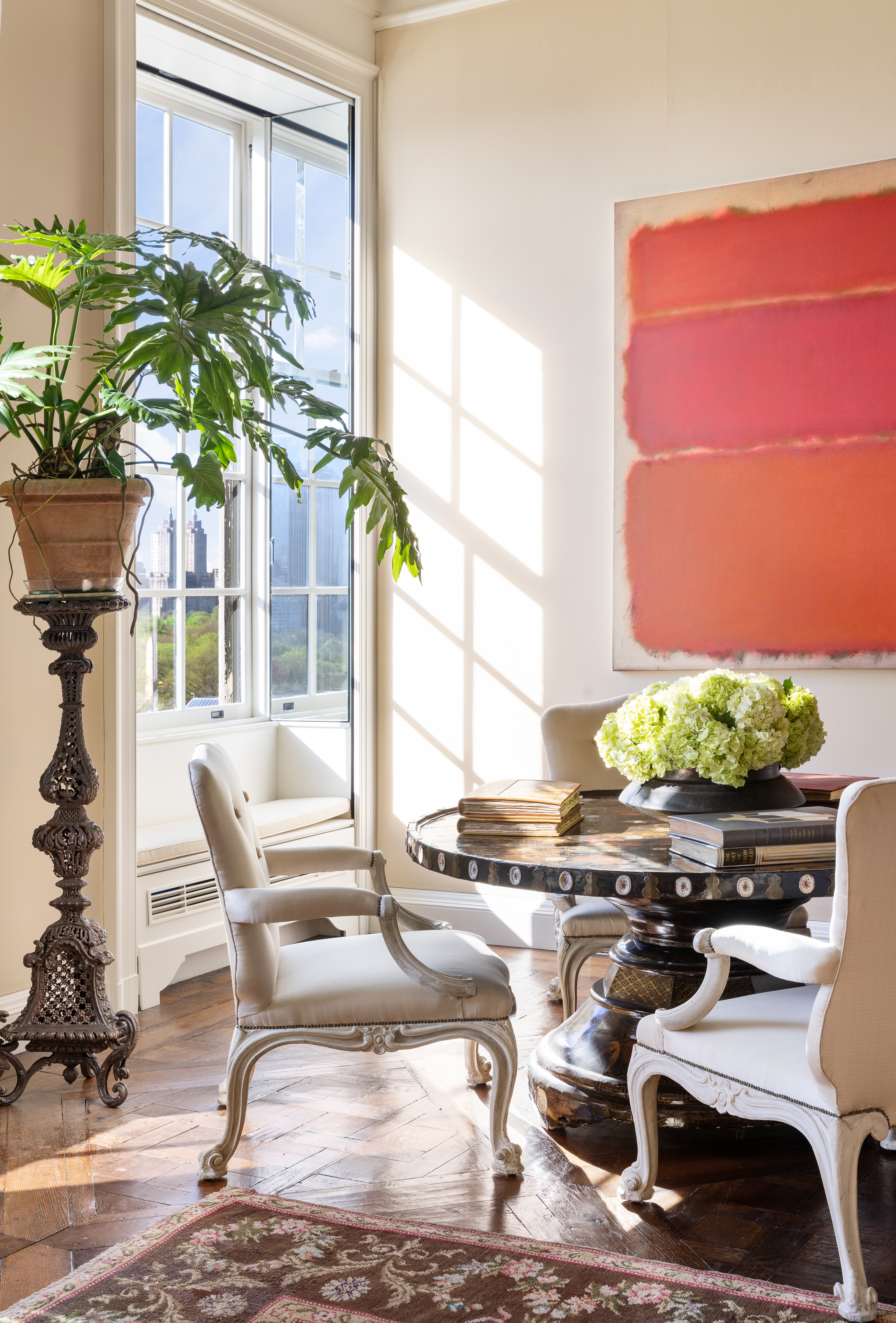 960 5th Avenue Manhattan, NY 10075 - Photo 3 of 13 a living room filled with furniture and a potted plant
