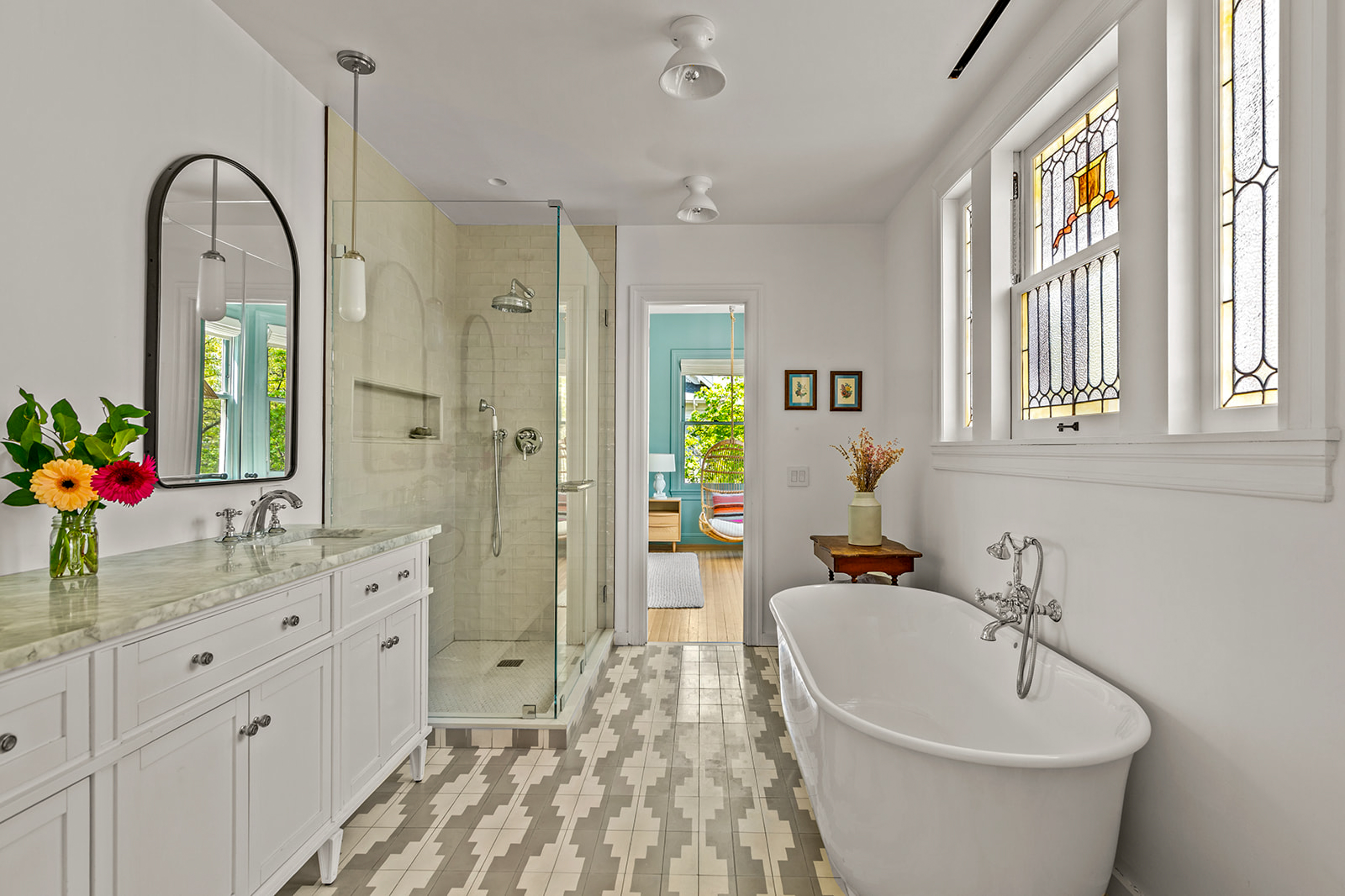 1221 Albemarle Road Brooklyn, NY 11218 - Photo 27 of 45 a spacious bathroom with a double vanity sink a mirror and a bathtub