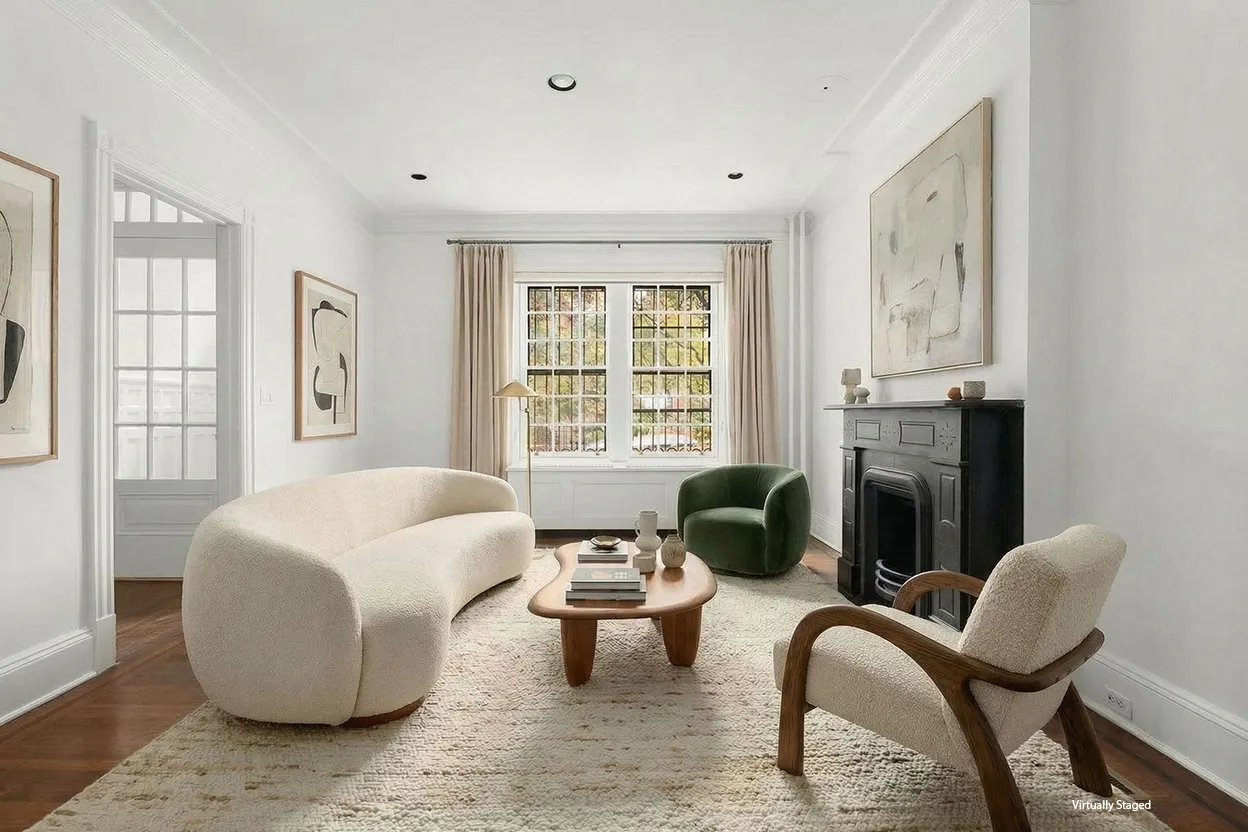 a living room with furniture and floor to ceiling windows