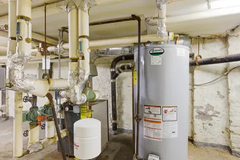 a picture of a wall with a white cabinet