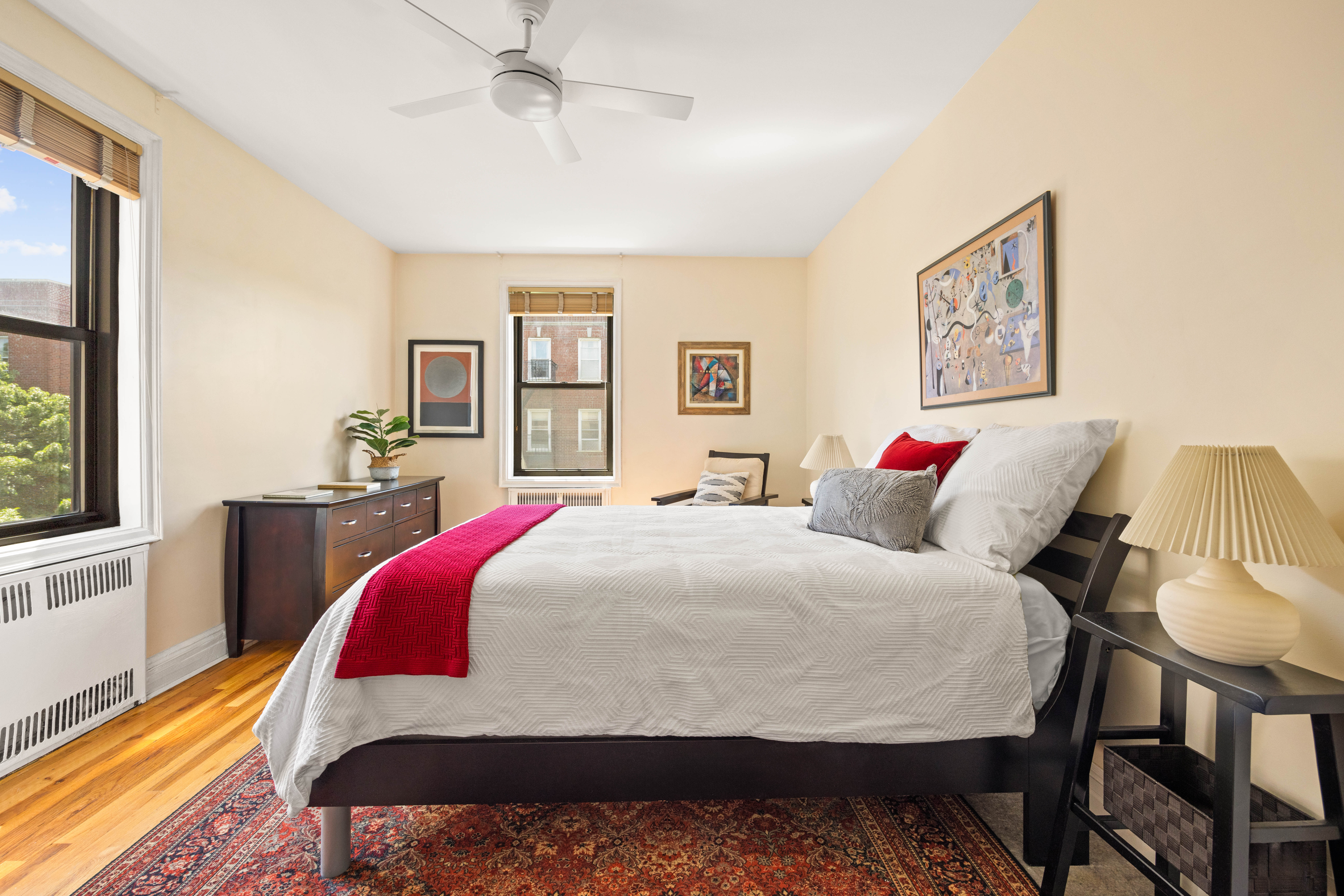 30 Ocean Parkway, Unit 5H Brooklyn, NY 11218 - Photo 6 of 17 a bedroom with a bed and wooden floor