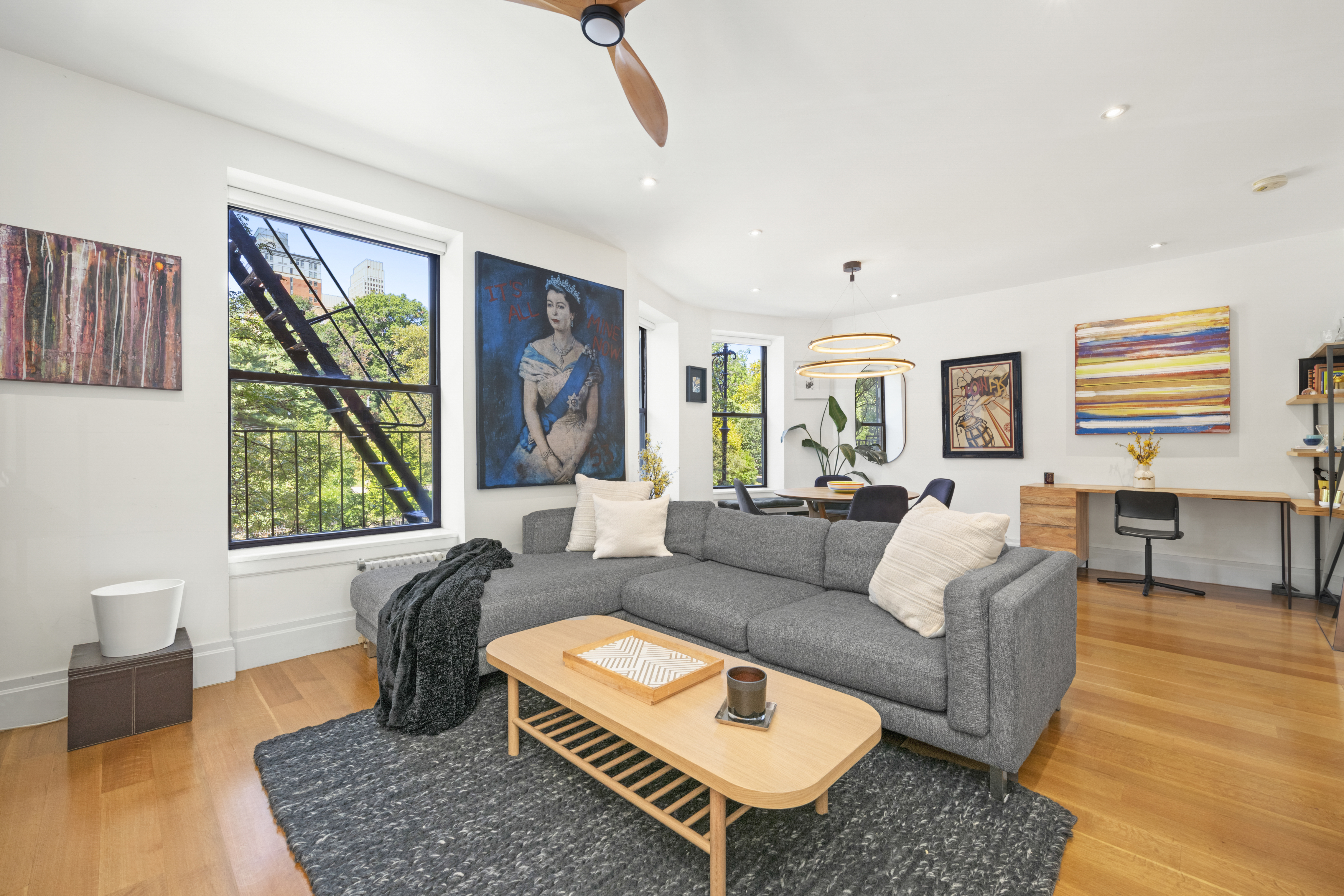 364 West 121st Street, Unit 2A Manhattan, NY 10027 - Photo 5 of 13 a living room with furniture and a large window