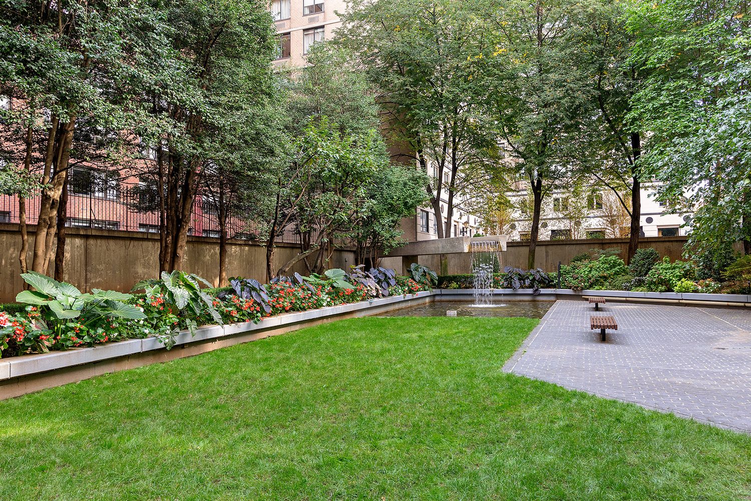 220 East 65th Street, Unit 8J Manhattan, NY 10065 - Photo 10 of 13 a view of a backyard with sitting area