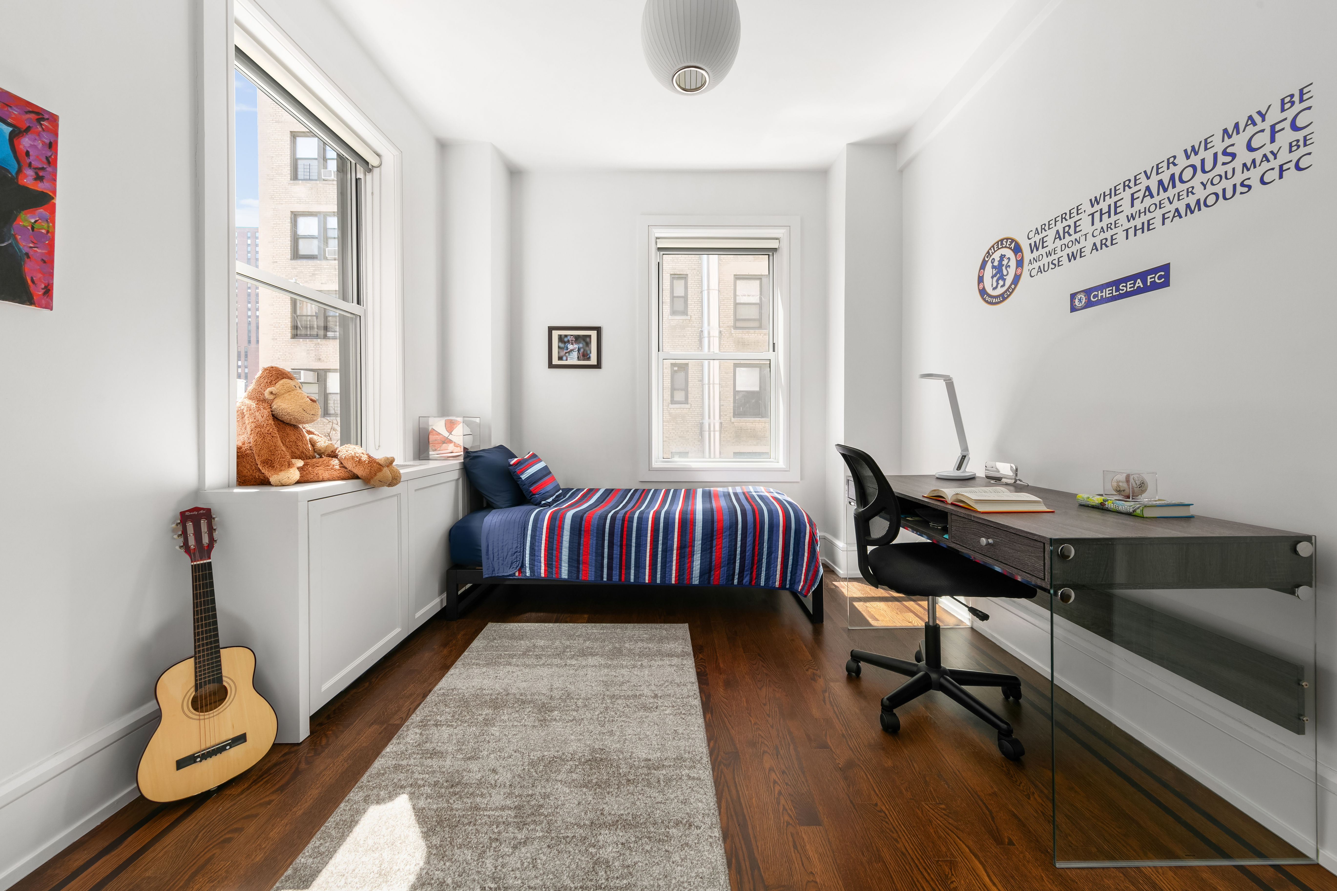 150 East 93rd Street, Unit 6AC Manhattan, NY 10128 - Photo 7 of 17 a bedroom with a bed and wooden floor