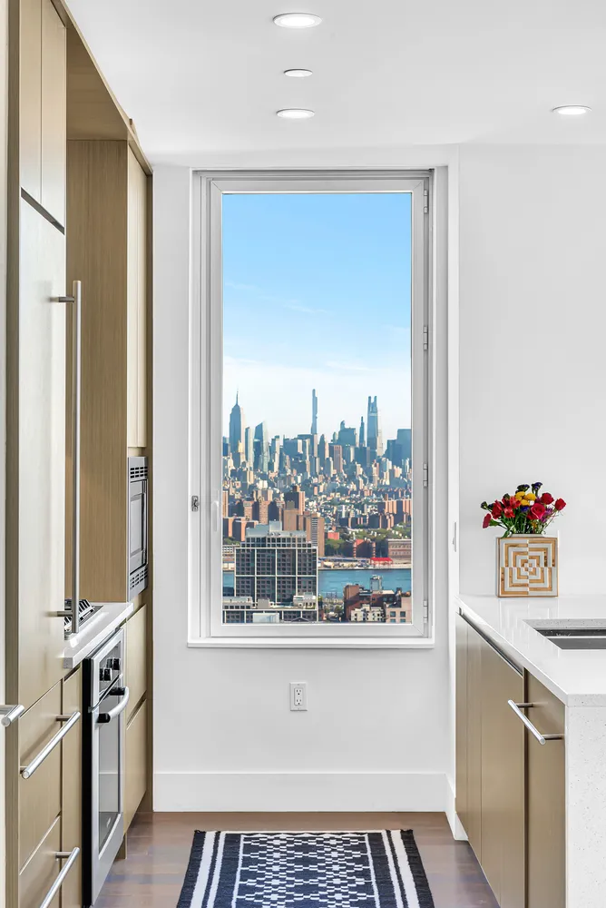 a view of a kitchen with a sink and dishwasher