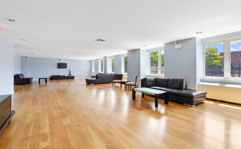 343 4th Avenue, Unit 2C Brooklyn, NY 11215 - Photo 9 of 12 a living room with furniture and a wooden floor
